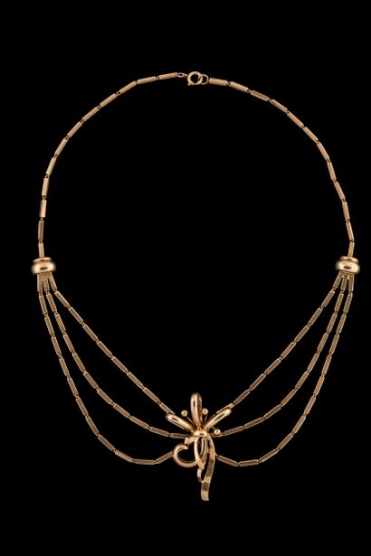 Drapery necklace adorned with a bow-shaped...