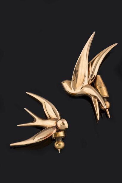 Two swallows-in-flight brooches or pins in...