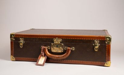 LOUIS VUITTON 
Valise de voyage rigide en...