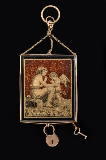 Pendant adorned with a scene of a woman with...