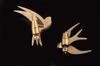 Two swallows-in-flight brooches or pins in...