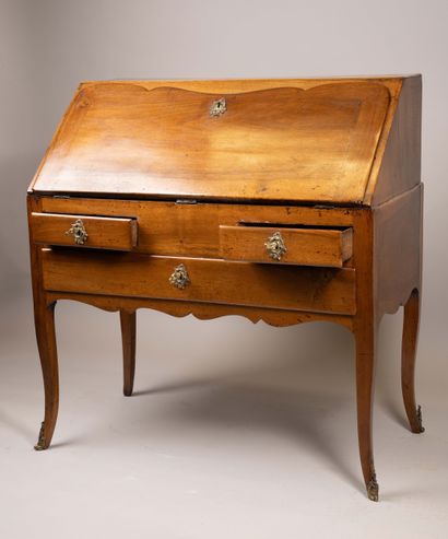 A sloping-top secretary desk made of molded...