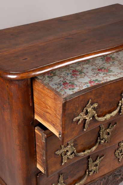 An “entre-deux” chest of drawers with a richly...