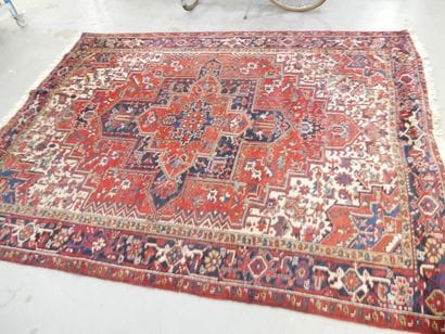 Oriental rug, red background with geometric...
