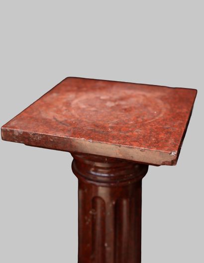 Fluted red marble column with an octagonal...