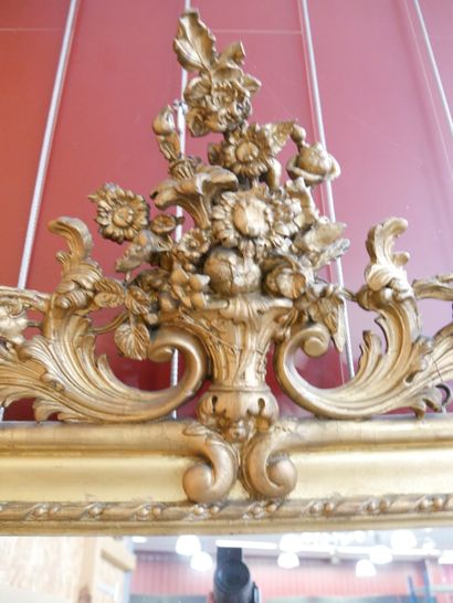 Wall-mounted mirror with a pediment made...