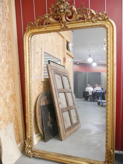 Wall-mounted mirror with a pediment made...