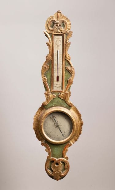 A scalloped-shaped barometer-thermometer...