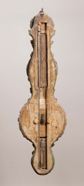 A scalloped-shaped barometer-thermometer...