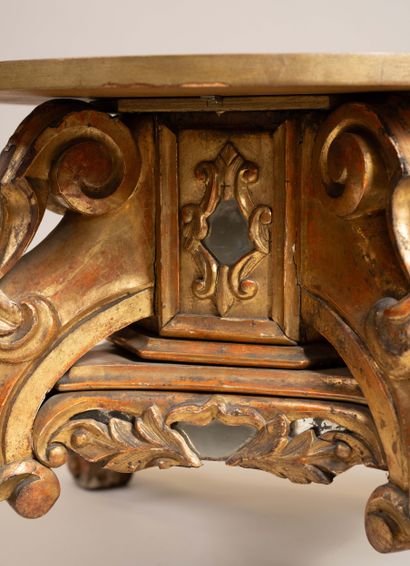 Molded, carved, and gilded wooden candelabra...