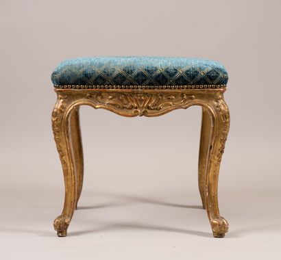 A quadrangular stool made of molded, carved,...