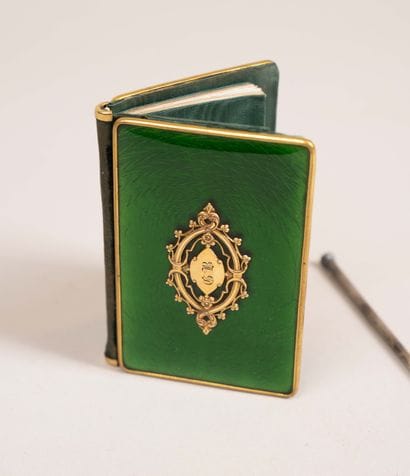 Dance card with green enamel background and...