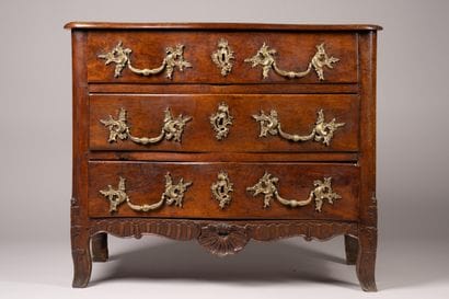 An “entre-deux” chest of drawers with a richly...