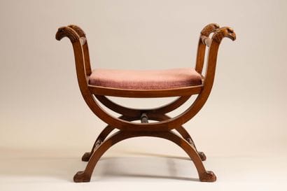 Curule stool in molded, turned, and carved...
