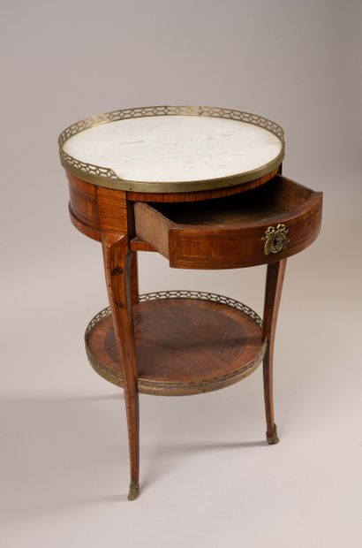 Circular table in rosewood veneer set within...