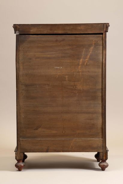 A small, chamfered mahogany cabinet with...