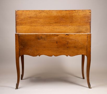 A sloping-top secretary desk made of molded...