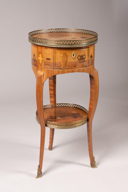 Drum table with a marquetry design featuring...