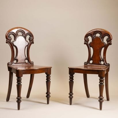 Pair of chairs with molded mahogany board...