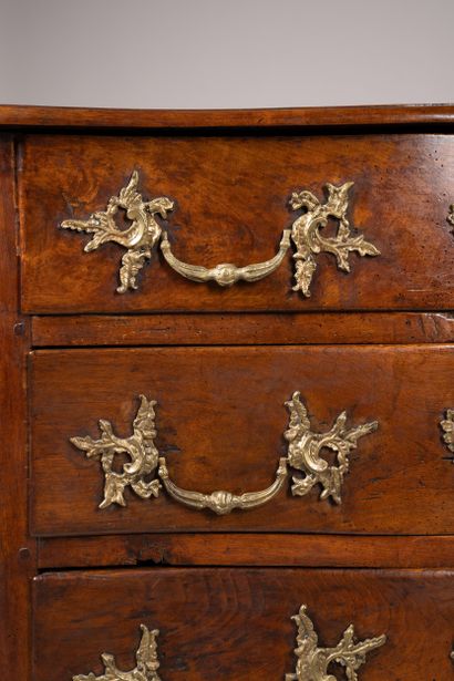 An “entre-deux” chest of drawers with a richly...