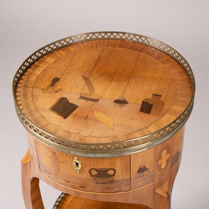 Drum table with a marquetry design featuring...