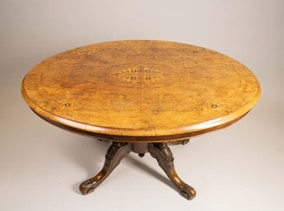 A light-colored wood and veneer coffee table...