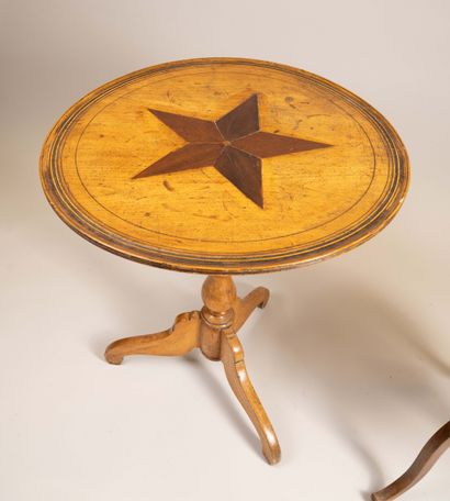 Side table with a tilting top made of molded...