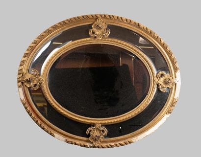 Oval mirror with Louis XV-style glazing beads,...