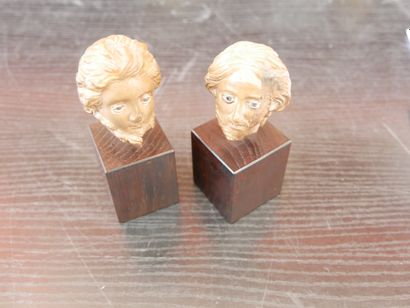 Two male heads carved in the round
Wood and...