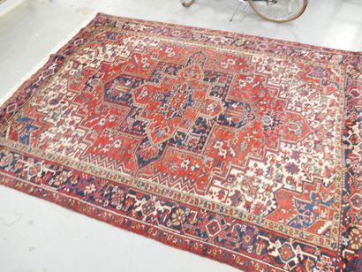 Oriental rug, red background with geometric...