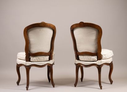 Pair of chairs with cabriolet backs in molded...