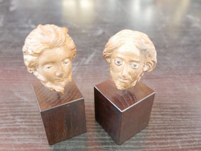 Two male heads carved in the round
Wood and...