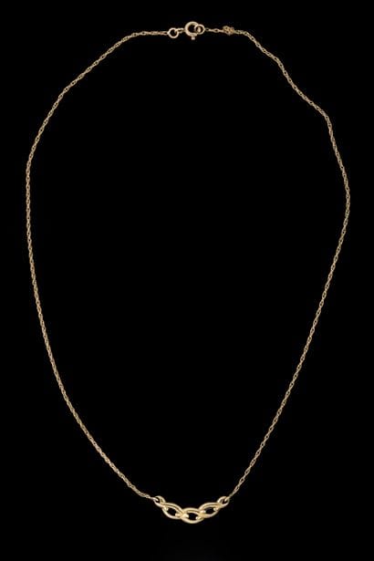 Necklace featuring a central braided design...