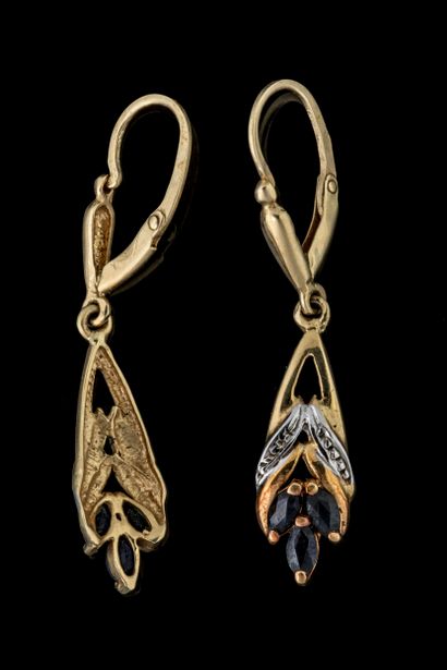 Dangle earrings, each set with three navette-cut...