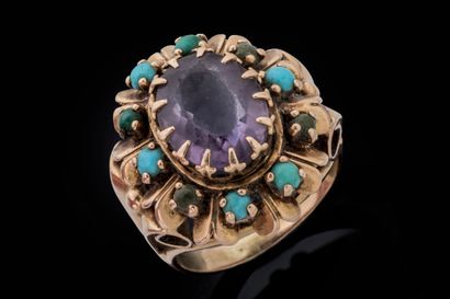Cocktail ring set with a faceted oval amethyst...