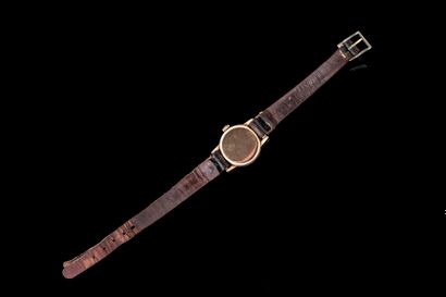 Women's watch with a gold-tone metal case...