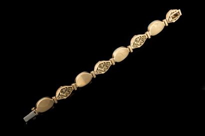Bracelet adorned with four oval matrix turquoise...
