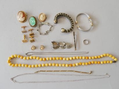 A set of costume jewelry, including silver...