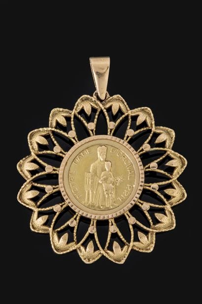 Large pendant featuring a medallion of Notre...