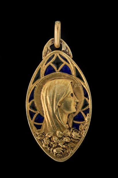 A diamond-shaped medal depicting the Virgin...