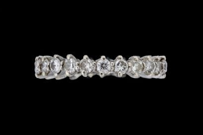 A ring set with 23 round-cut diamonds of...