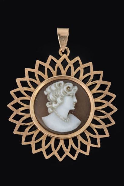 Openwork pendant featuring radiating ogives;...