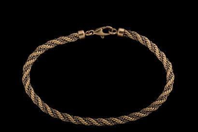 Twisted bracelet adorned with a yellow and...