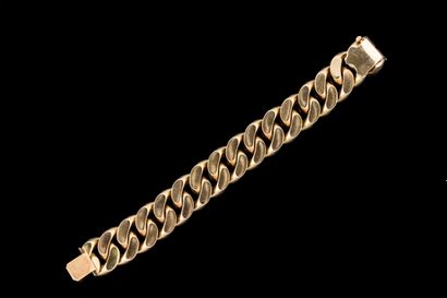 A substantial, wide yellow gold (750) link...
