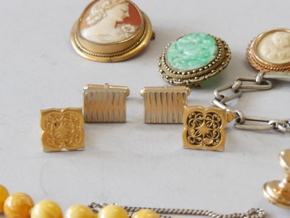 A set of costume jewelry, including silver...