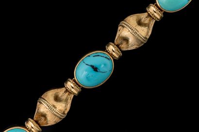 Bracelet adorned with four oval matrix turquoise...