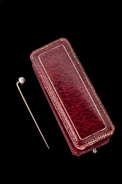Tie pin adorned with a pearlescent pearl...