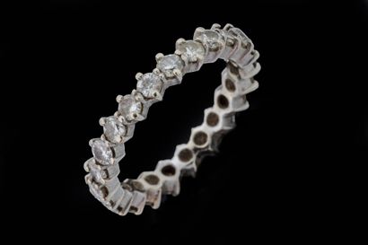A ring set with 23 round-cut diamonds of...
