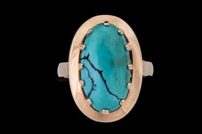 Marquise-shaped ring set with a matrix turquoise...