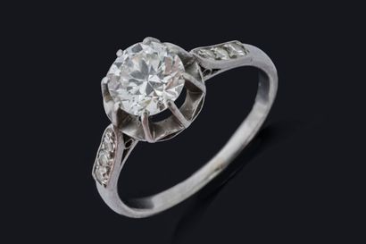 Solitaire ring set with an antique-cut diamond...